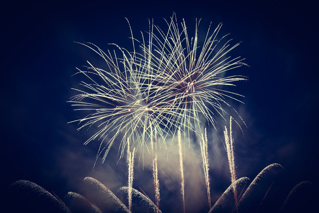 Spectacular fireworks show light up the sky. New year celebration background